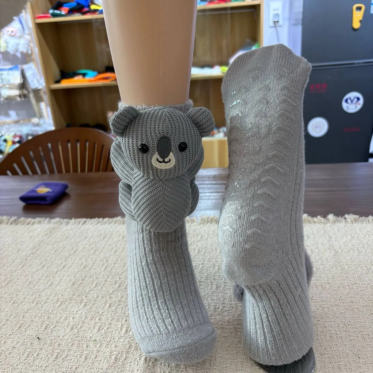 Gray koala Wildsoles worn at home, showing the knit detail
